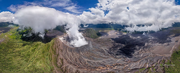 Low clouds and the smoke of the volcano Low clouds and the smoke of the volcano