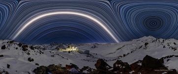 Starry sky over mount Elbrus. Above the Mir station