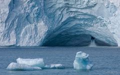 Icebergs and Ice cave waterfall. Austfonna Ice Cap, Nordaustlandet Island Icebergs and Ice cave waterfall. Austfonna Ice Cap, Nordaustlandet Island
