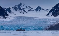 Expedition boat in-front of Monaco Glacier. Liefdefjorden (Love-fjord) Expedition boat in-front of Monaco Glacier. Liefdefjorden (Love-fjord)