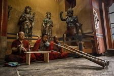 Playing a musical instrument during a puja