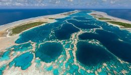 Central pools of the lagoon, divided by razor-sharp coral barriers Central pools of the lagoon, divided by razor-sharp coral barriers