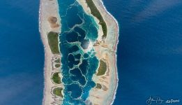 Caroline atoll — a jewel glittering in the midday sun