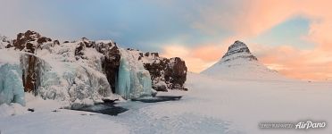 Mount Kirkjufell and frozen waterfall