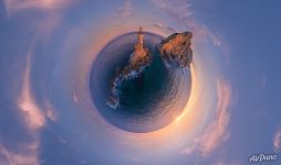 Lighthouse and Cape Aniva at sunrise. Planet