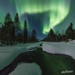 Northern lights over a non-freezing river