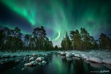 Northern lights over a non-freezing river Northern lights over a non-freezing river