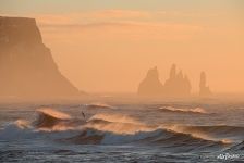 Reynisfjara beach, Seastacks Reynisdrangar, South Iceland, waves and morning fog Reynisfjara beach, Seastacks Reynisdrangar, South Iceland, waves and morning fog